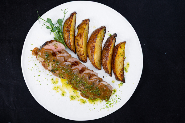 Pork tenderloin with creamy pepper sauce and oven-roasted herb potatoes