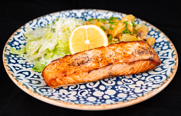 SALMON WITH BAKED POTATOES, ALFREDO CREAM SAUCE AND FRESH SALAD
